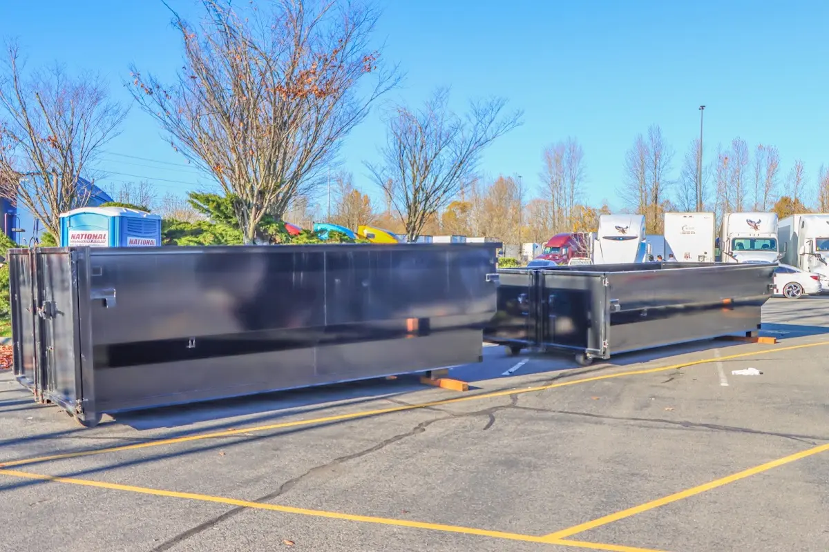 Professional dumpster rental service with roll-off container on residential driveway in Port St. Lucie